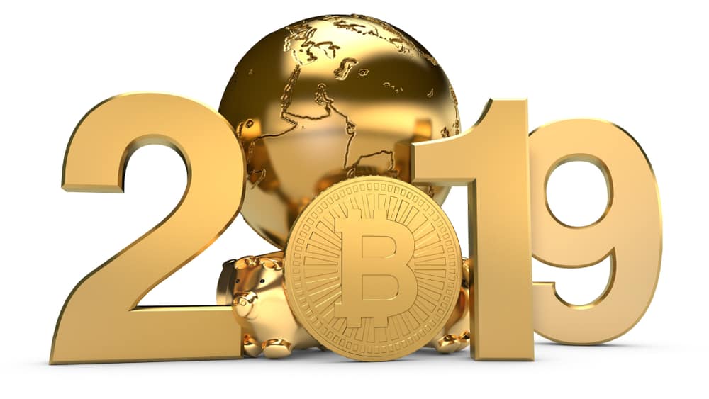 A golden 3D "2019" model with a globe and Bitcoin symbol highlights the year to buy bitcoin.