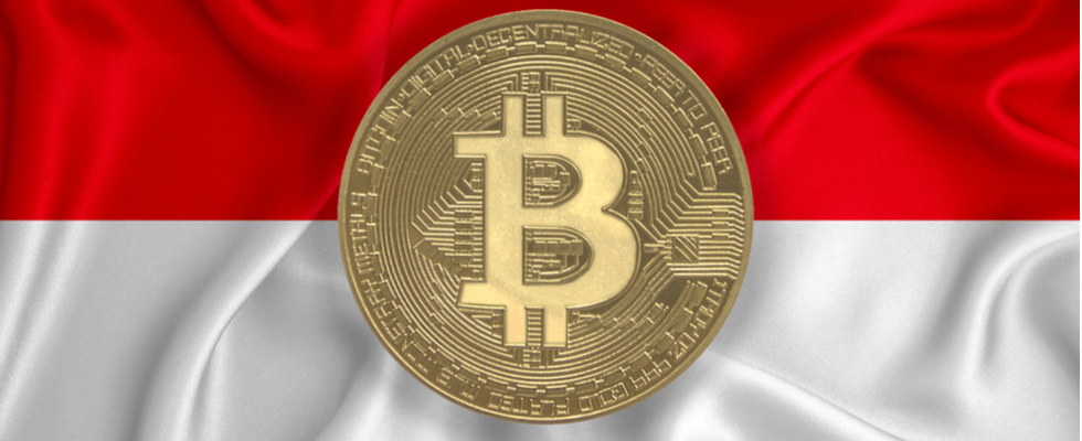 A large gold BTC coin centered on a wavy red and white flag background. Buy Bitcoin on Coinmama.