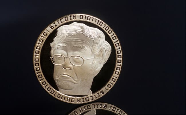 A gold coin with a skeptical elderly man, "BITCOIN" inscribed, and binary code; buy crypto at Coinmama.