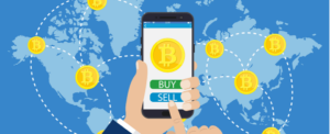 Illustration: Hand holding a smartphone with "BUY" Bitcoin button on Coinmama, connecting global crypto transactions.