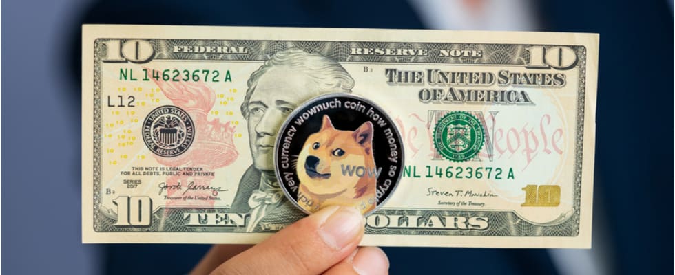A US ten-dollar bill with a Dogecoin token over Hamilton, highlighting the trend to buy crypto on Coinmama.